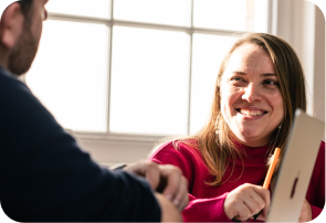 Woman smiling over laptop